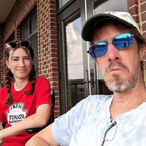 Phil and daughter on a balcony